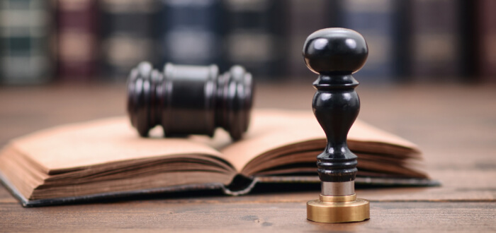 A gavel with a book of law