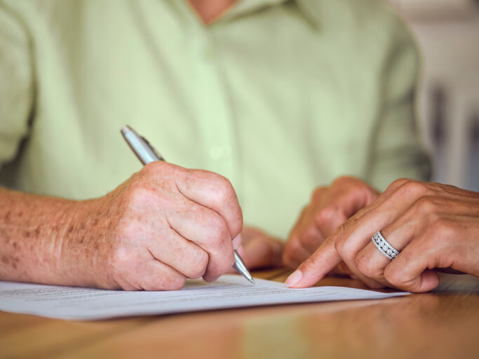 Older woman working on her will