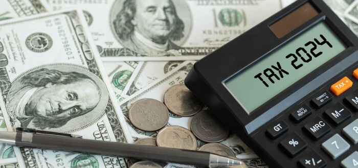 A calculator with tax 2024 written on it