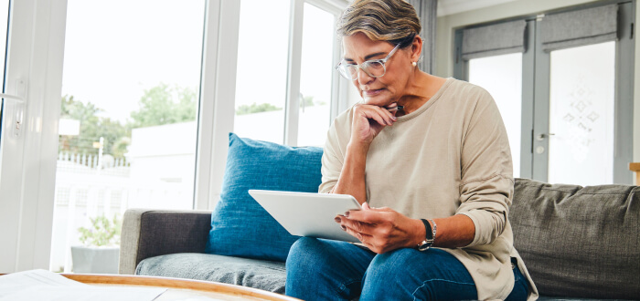 A woman reads over documents for estate planning