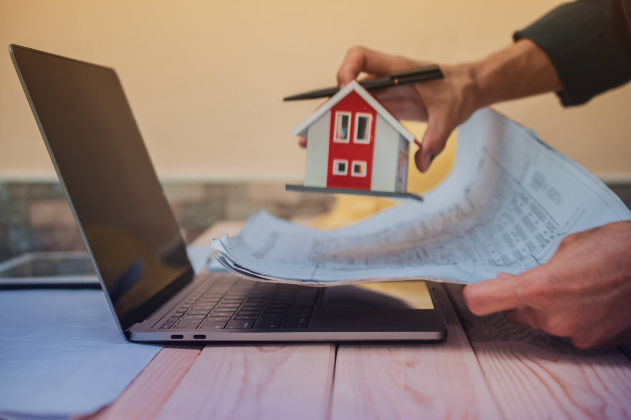 Engineer design planning house building project by computer laptop blueprint